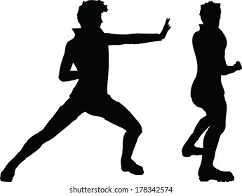 EPS 10 Vector of man silhouette in Karate position on white background