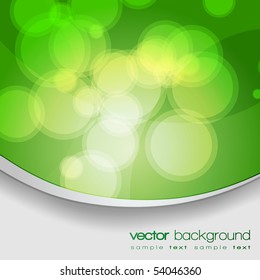 EPS10 Glittering green lights background with text - vector