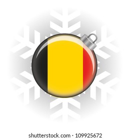 EPS10 Vector illustration of the Belgium flag in a bauble with snowflake in background