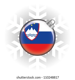 EPS10 Vector illustration of the Slovenia flag in a bauble with snowflake in background