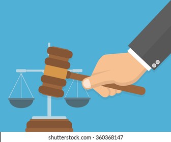 Equality in front of the law or fair decision concept. Hand holding judges`s gavel with a justice balance in the background. Flat design