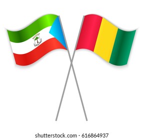 Equatorial Guinean and Guinean crossed flags. Equatorial Guinea combined with Guinea isolated on white. Language learning, international business or travel concept.
