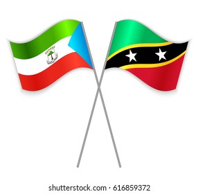 Equatorial Guinean and Kittitian crossed flags. Equatorial Guinea combined with Saint Kitts and Nevis isolated on white. Language learning, international business or travel concept.
