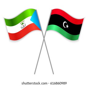 Equatorial Guinean and Libyan crossed flags. Equatorial Guinea combined with Libya isolated on white. Language learning, international business or travel concept.