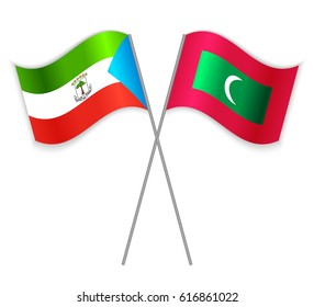 Equatorial Guinean and Maldivian crossed flags. Equatorial Guinea combined with Maldives isolated on white. Language learning, international business or travel concept.