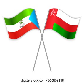 Equatorial Guinean and Omani crossed flags. Equatorial Guinea combined with Oman isolated on white. Language learning, international business or travel concept.