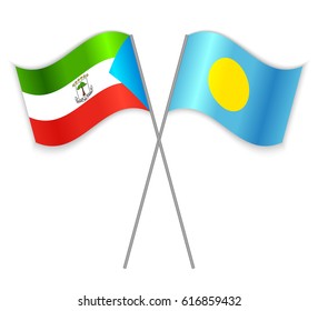 Equatorial Guinean and Palauan crossed flags. Equatorial Guinea combined with Palau isolated on white. Language learning, international business or travel concept.
