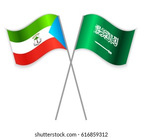 Equatorial Guinean and Saudi Arabian crossed flags. Equatorial Guinea combined with Saudi Arabia isolated on white. Language learning, international business or travel concept.