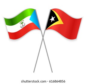 Equatorial Guinean and Timorese crossed flags. Equatorial Guinea combined with East Timor isolated on white. Language learning, international business or travel concept.