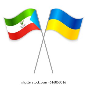 Equatorial Guinean and Ukrainian crossed flags. Equatorial Guinea combined with Ukraine isolated on white. Language learning, international business or travel concept.