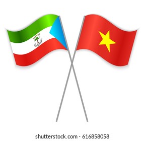 Equatorial Guinean and Vietnamese crossed flags. Equatorial Guinea combined with Vietnam isolated on white. Language learning, international business or travel concept.