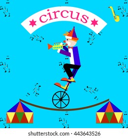 Equilibrist clown plaing trumpet in circus