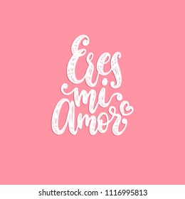 Eres Mi Amor, vector hand lettering. Translation from Spanish to English of phrase You Are My Love. Calligraphic romantic inscription on pink background.