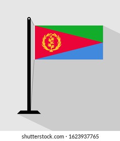 Eritrea flag on pole, isolated on gray background