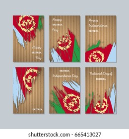 Eritrea Patriotic Cards for National Day. Expressive Brush Stroke in Flag Colors on kraft paper background. Vector Greeting Card.