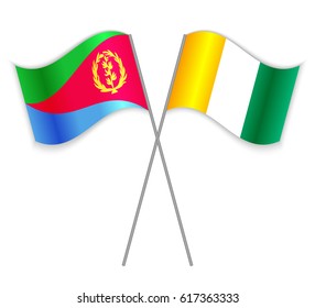 Eritrean and Ivorian crossed flags. Eritrea combined with Ivory Coast isolated on white. Language learning, international business or travel concept.