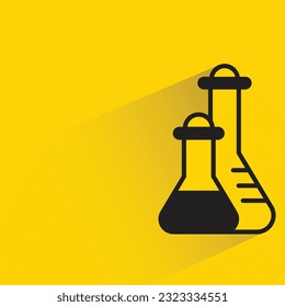 erlenmeyer flask with shadow on yellow background