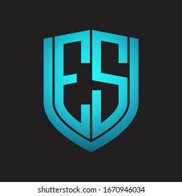 ES Logo monogram with emblem shield design isolated with blue colors on black background