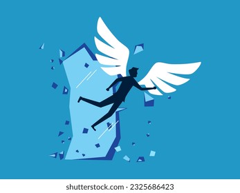 Escape to a bigger goal. man with wings flying breaks the wall barrier
