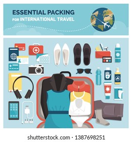 Essential packing for international travel, tourism and vacations: accessories, clothing and open suitcase, top view