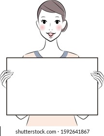 esthetician therapist holding white board for your text