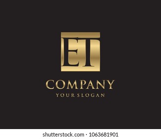 ET initial letters looping linked box elegant logo golden black background