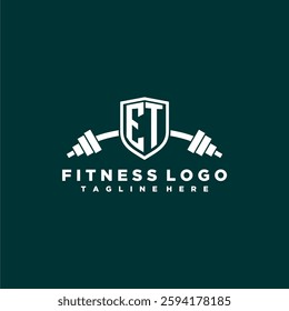 ET initial monogram for fitnes or gym logo with creative shield and barbell design