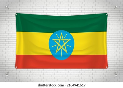 Ethiopia flag hanging on brick wall. 3D drawing. Flag attached to the wall. Neatly drawing in groups on separate layers for easy editing.