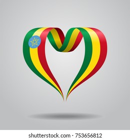 Ethiopian flag heart-shaped wavy ribbon. Vector illustration.