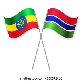 Ethiopian and Gambian crossed flags. Ethiopia combined with Gambia isolated on white. Language learning, international business or travel concept.