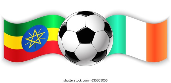 Ethiopian and Irish wavy flags with football ball. Ethiopia combined with Ireland isolated on white. Football match or international sport competition concept.