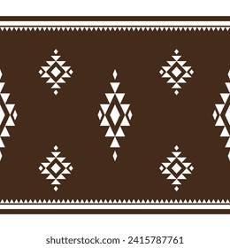 Ethnic abstract ikat art .Geometric ethnic brown and white seamless pattern  design for carpet,curtain,clothing,fabric,wrapping paper,tiles,textiles,batik,texture and wallpaper.Vector background.