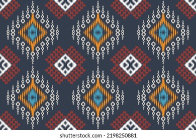 Ethnic abstract ikat art. Seamless pattern in tribal, The most intricately patterned fabrics. pattern textiles that employ resist dyeing on the yarns prior to dyeing and weaving the fabric.