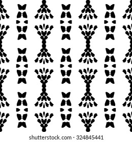 Ethnic Aztec pattern. Striped hand painted vector seamless pattern with ethnic and tribal motifs, zigzag lines, brushstrokes and splatters of paint black and white colors Vector illustration.
