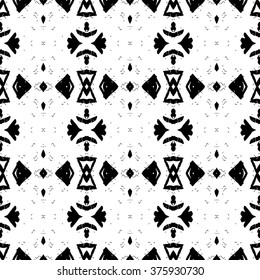 Ethnic Aztec pattern. Striped hand painted aztec vector seamless pattern with ethnic and tribal motifs, zigzag lines, brushstrokes and splatters of paint black and white colors Vector illustration.