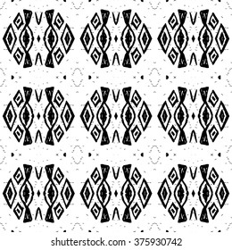 Ethnic Aztec pattern. Striped hand painted aztec vector seamless pattern with ethnic and tribal motifs, zigzag lines, brushstrokes and splatters of paint black and white colors Vector illustration.