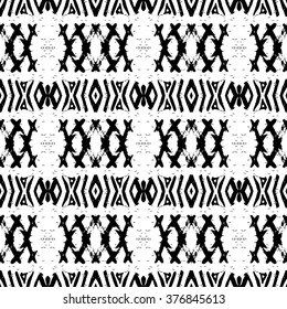 Ethnic Aztec pattern. Striped hand painted aztec vector seamless pattern with ethnic and tribal motifs, zigzag lines, brushstrokes and splatters of paint black and white colors Vector illustration.