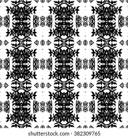 Ethnic Aztec pattern. Striped hand painted aztec vector seamless pattern with ethnic and tribal motifs, zigzag lines, brushstrokes and splatters of paint black and white colors Vector illustration.