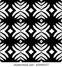 Ethnic aztec seamless pattern. Striped hand painted seamless pattern with ethnic and tribal motifs, zigzag lines, brushstrokes and splatters of paint vibrant colors. Ikat mexican motif.