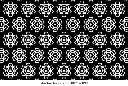 Ethnic black and white pattern. Geometric background from abstract flowers in folk style. Template.
