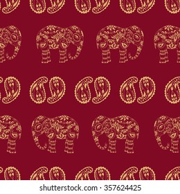 Ethnic bohemian seamless pattern. Endless texture with stylized patterned elephant and paisley in Indian style.