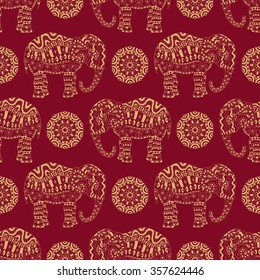 Ethnic bohemian seamless pattern. Endless texture with stylized patterned elephant and mandala in Indian style.