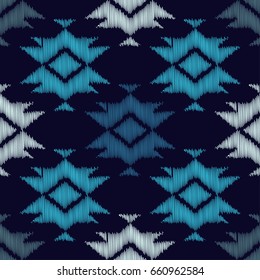 Ethnic boho blue seamless pattern. Embroidery on fabric. Retro motif. Vector illustration. Textile rapport.