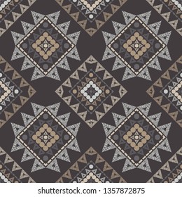 Ethnic boho seamless pattern. Embroidery on fabric. Patchwork texture. Weaving. Traditional ornament. Tribal pattern. Folk motif. Can be used for wallpaper, textile, invitation card, wrapping, web.