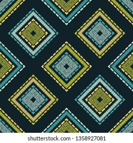 Ethnic boho seamless pattern. Embroidery on fabric. Patchwork texture. Weaving. Traditional ornament. Tribal pattern. Folk motif. Can be used for wallpaper, textile, invitation card, wrapping, web.