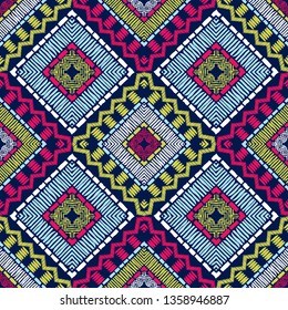 Ethnic boho seamless pattern. Embroidery on fabric. Patchwork texture. Weaving. Traditional ornament. Tribal pattern. Folk motif. Can be used for wallpaper, textile, invitation card, wrapping, web.