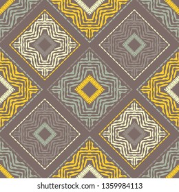 Ethnic boho seamless pattern. Embroidery on fabric. Patchwork texture. Weaving. Traditional ornament. Tribal pattern. Folk motif. Can be used for wallpaper, textile, invitation card, wrapping, web.