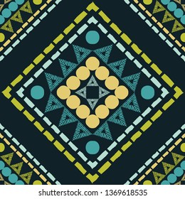 Ethnic boho seamless pattern. Embroidery on fabric. Patchwork texture. Weaving. Traditional ornament. Tribal pattern. Folk motif. Can be used for wallpaper, textile, invitation card, wrapping, web.