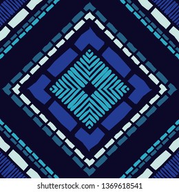Ethnic boho seamless pattern. Embroidery on fabric. Patchwork texture. Weaving. Traditional ornament. Tribal pattern. Folk motif. Can be used for wallpaper, textile, invitation card, wrapping, web.
