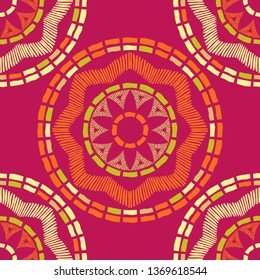 Ethnic boho seamless pattern. Embroidery on fabric. Patchwork texture. Weaving. Traditional ornament. Tribal pattern. Folk motif. Can be used for wallpaper, textile, invitation card, wrapping, web.